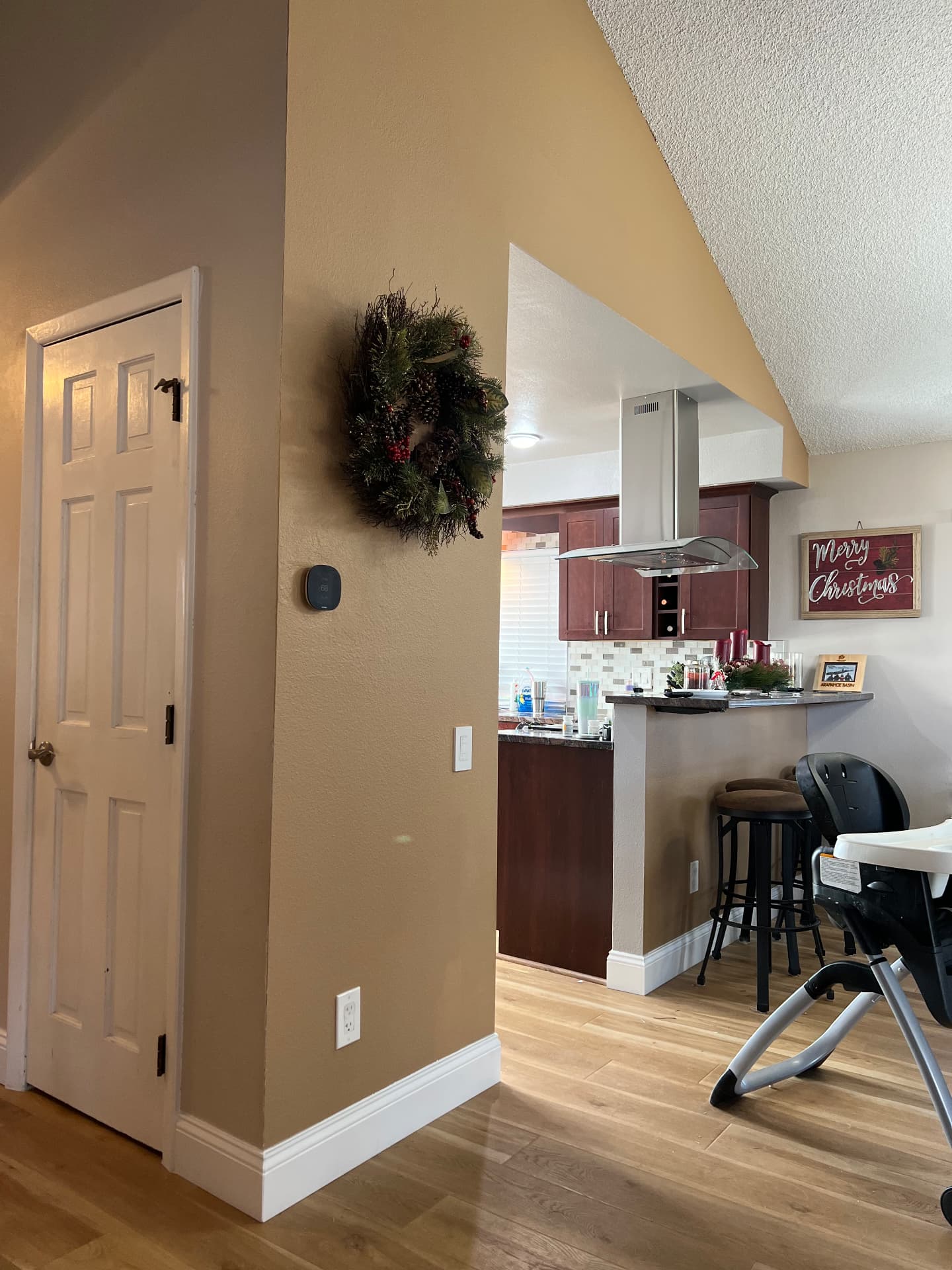 Widened opening with breakfast bar and island range hood after remodel