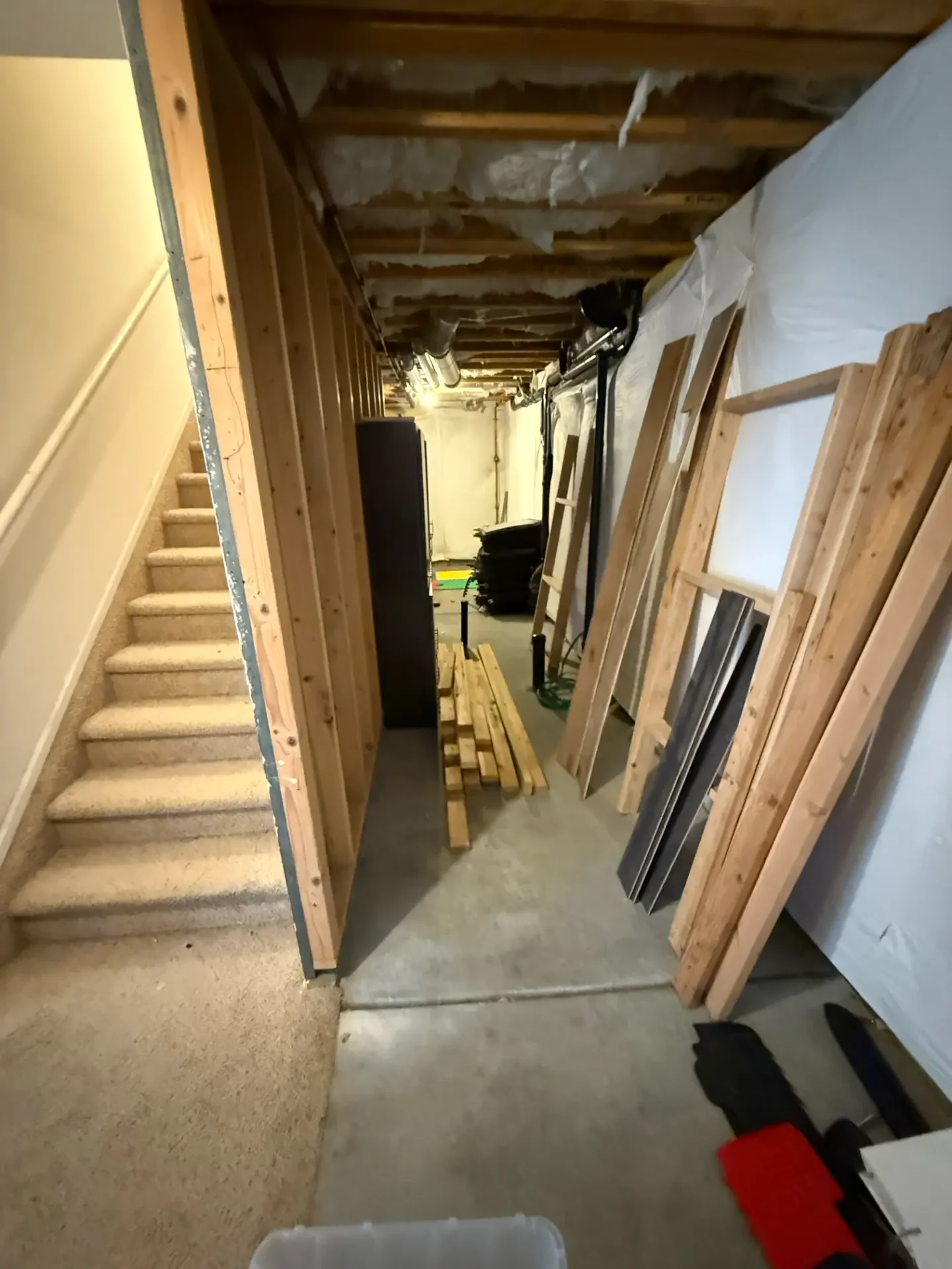 Unfinished basement framing before JR Burcham remodel
