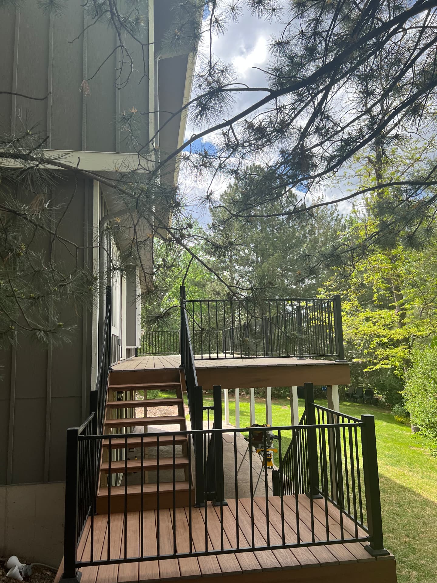 New composite deck with black aluminum railings and stairs